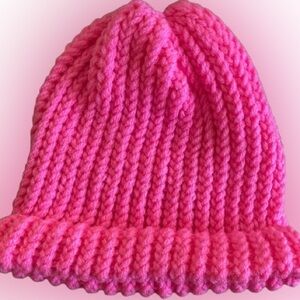 Handmade bright pink knitted beanie hat for adults